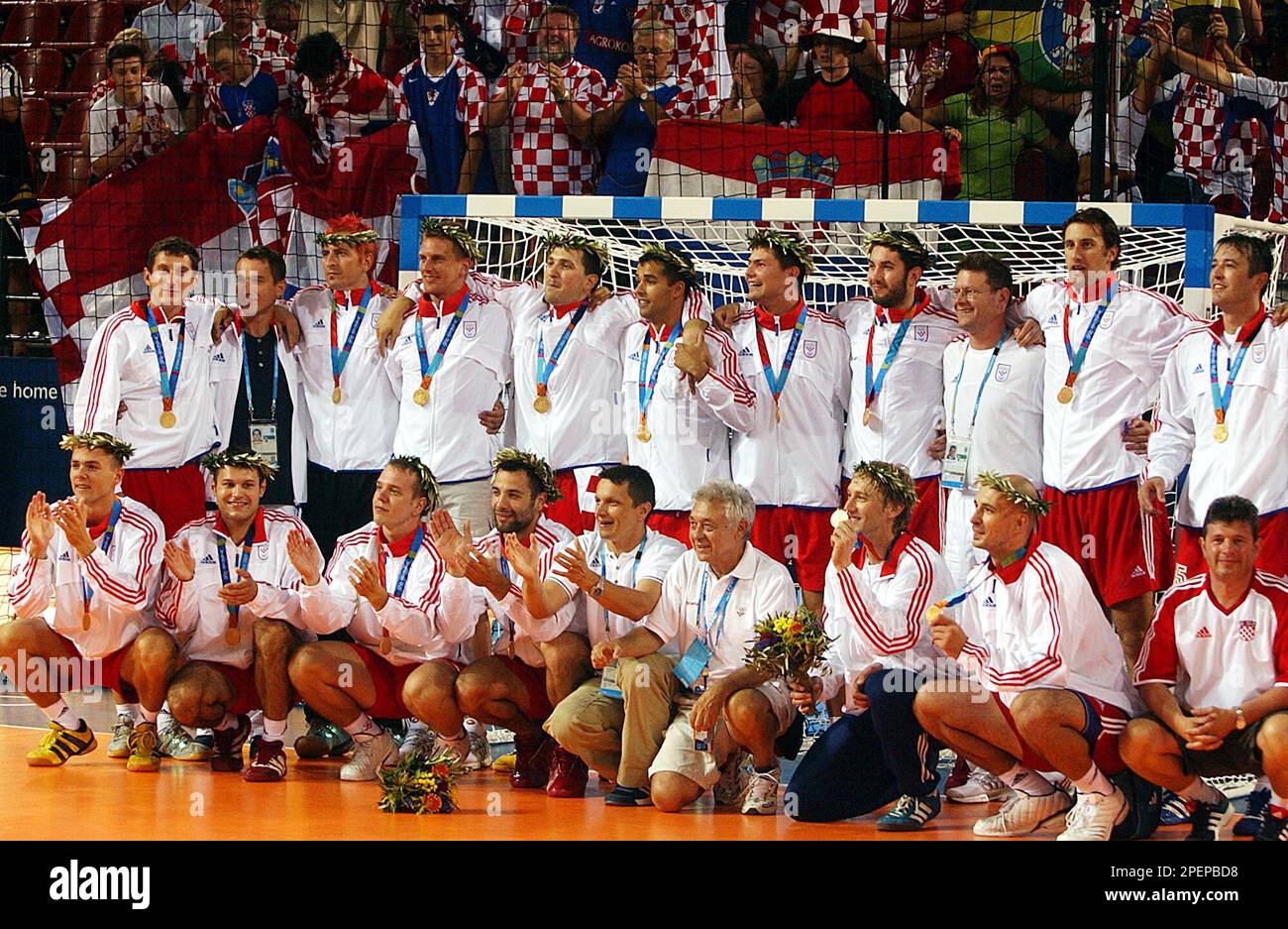 Croatia's team display their gold medal after the final handball match