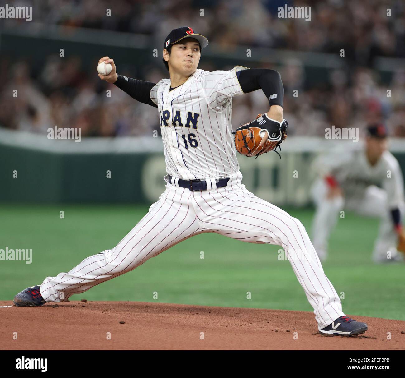 Japanese Shohei Ohtani throws a ball in the first inning during