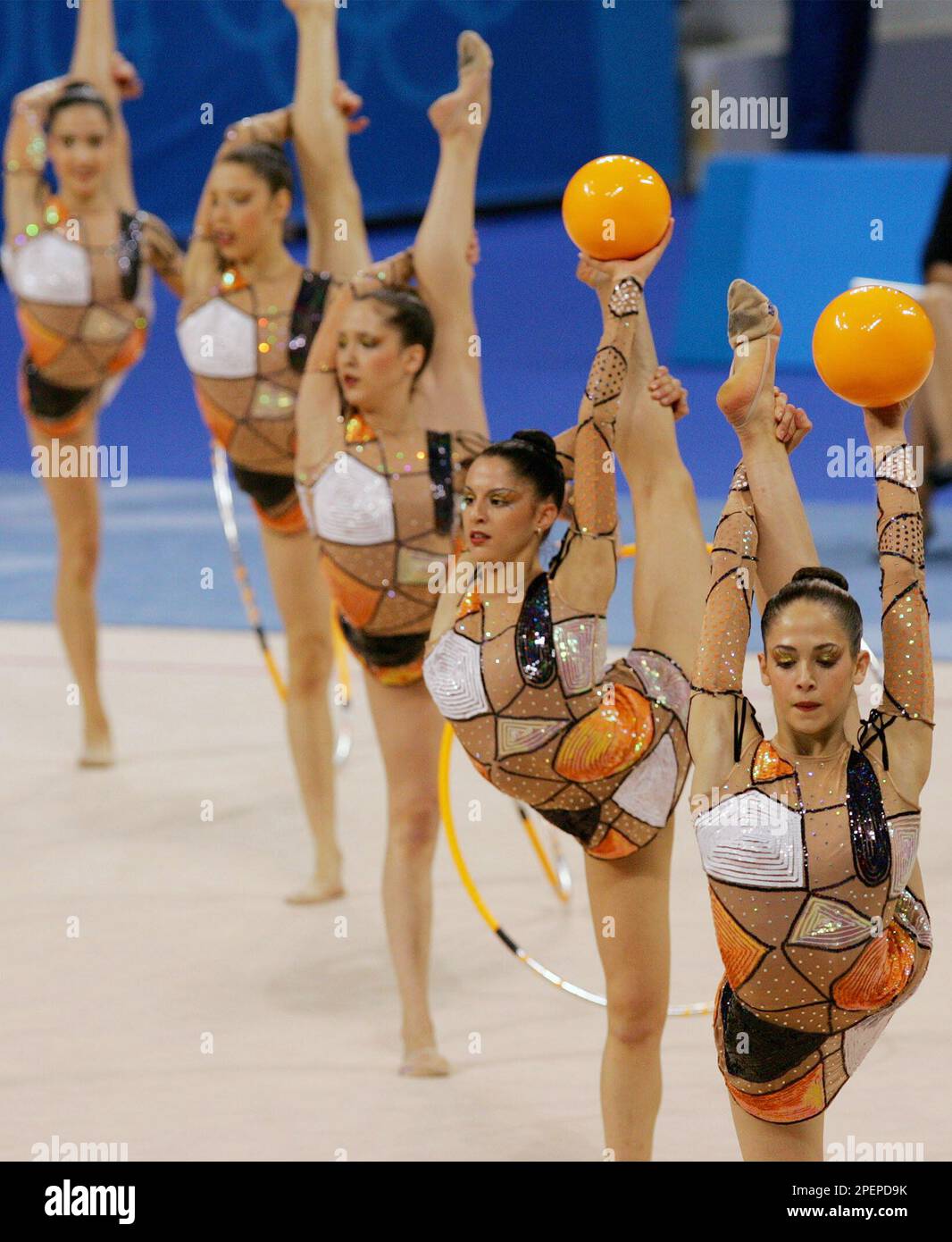 Members of the Spanish team perform with hoops and balls during the