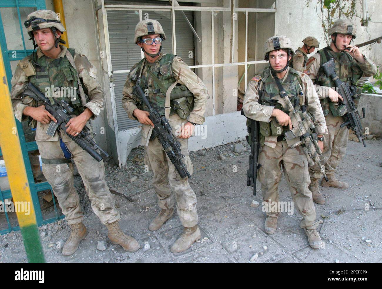 U.S. Army soldiers await transportation from central Najaf, Iraq