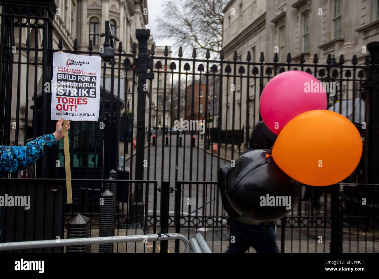 London, UK. 15th Mar, 2023. London, UK - March 15, 2023: On Budget Day, amid a 24-hour general strike involving numerous unions and workers, a socialist protester stood in front of Downing Street. Credit: Sinai Noor/Alamy Live News Stock Photo