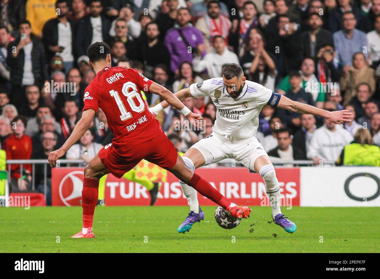 Cody Gakpo of Liverpool FC and Karim Benzema of Real Madrid during the UEFA Champions League, Round of 16, 2nd leg football match between Real Madrid CF and Liverpool FC on March 15, 2023 at Santiago Bernabeu stadium in Madrid, Spain - Photo: Irina R Hipolito/DPPI/LiveMedia Stock Photo