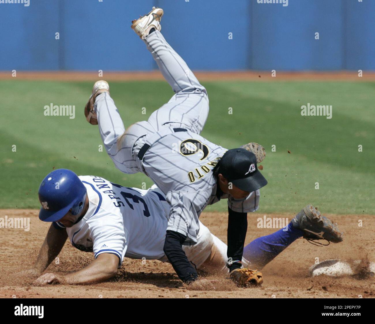 Japan shortstop Shinya Miyamoto (6) tumbles over Greece Japan shortstop Shinya Miyamoto (6) tumbles over Greece