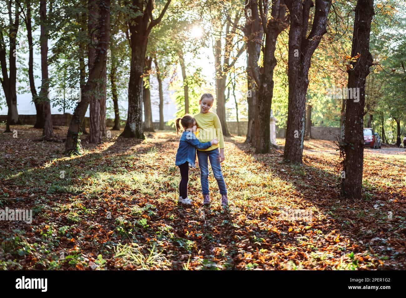 Two girls playing in the forest hi-res stock photography and images - Alamy