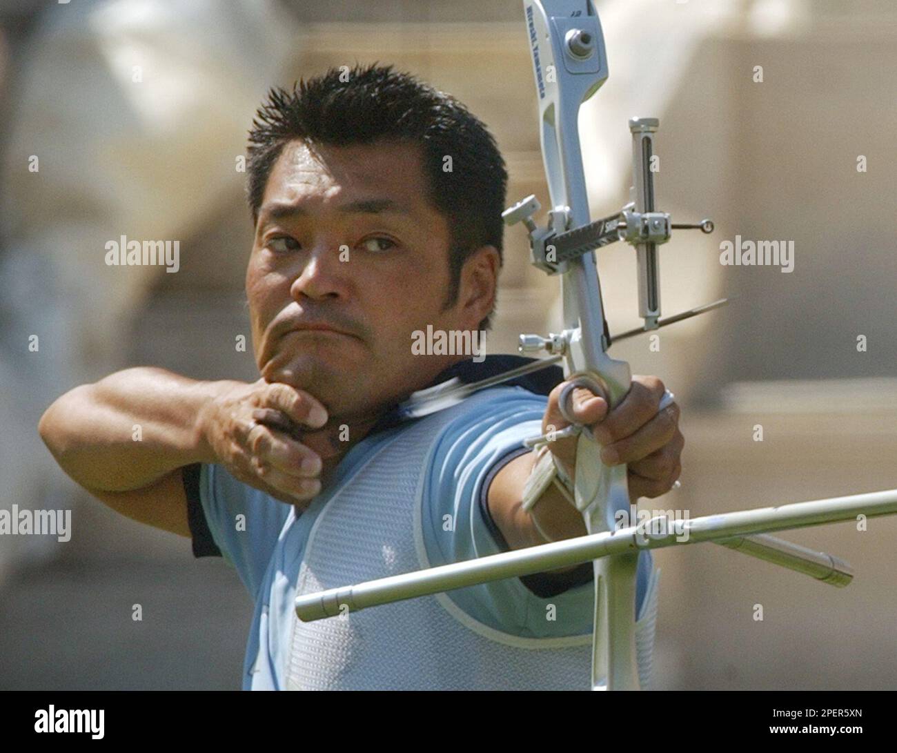 Hiroshi Yamamoto of Japan shoots his arrow during his victory in