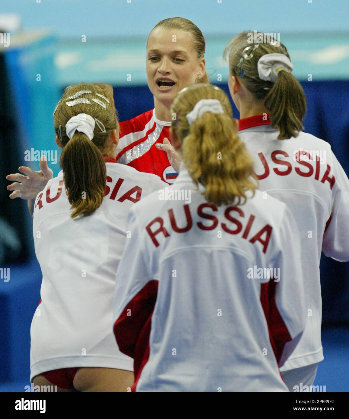 Russias Svetlana Khorkina Center Is Greeted By Teammates Following