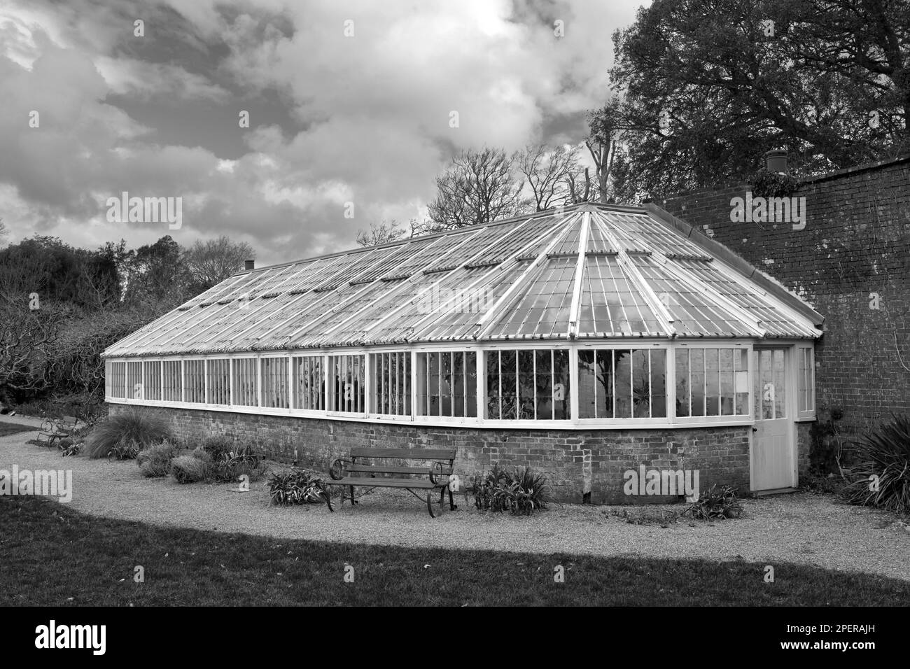 Large Victorian glasshouse (greenhouse) in the garden at Greenway, Galmpton, Devon, England, UK Stock Photo