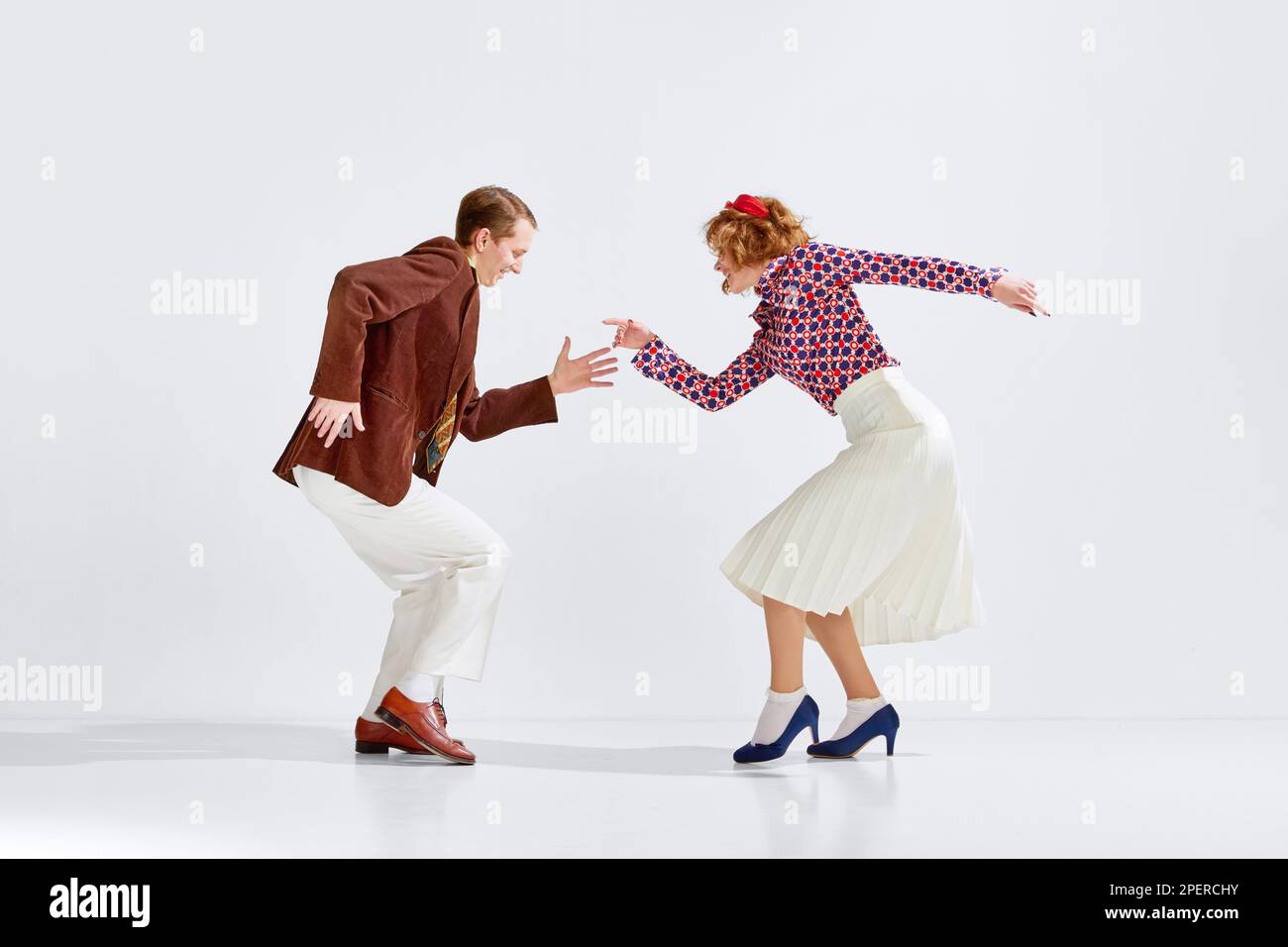 Old-school party. Young cheerful man and woman in stylish clothes ...