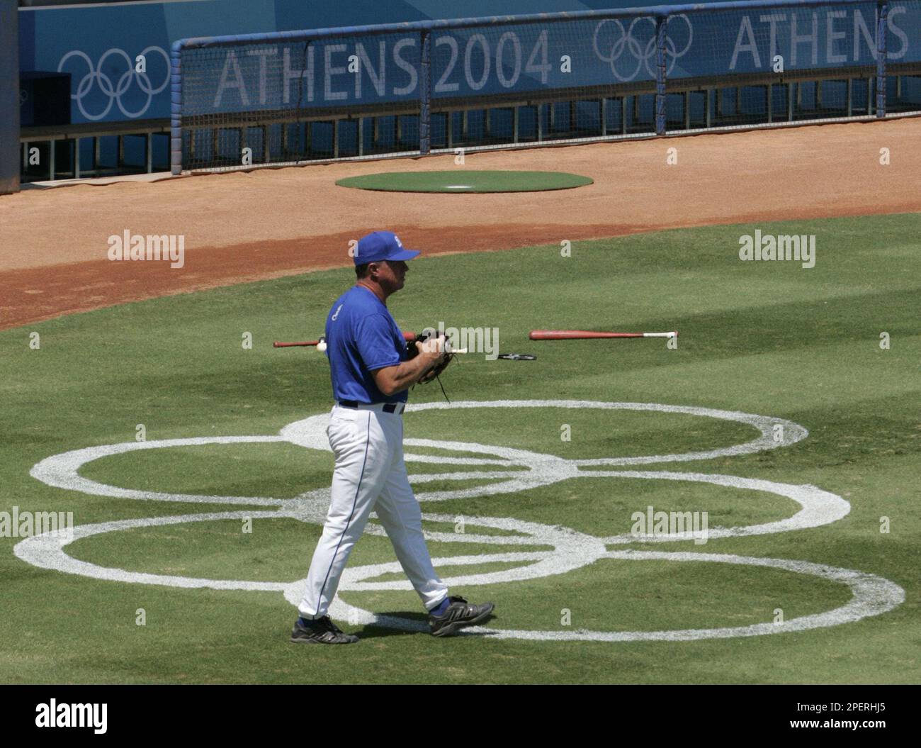 Dusty Rhodes, from Florida, manager of the Greek baseball team, walks onto the field during practice, Saturday, Aug. 2004, at the Olympic baseball center in Athens, Greece. (AP Behrman