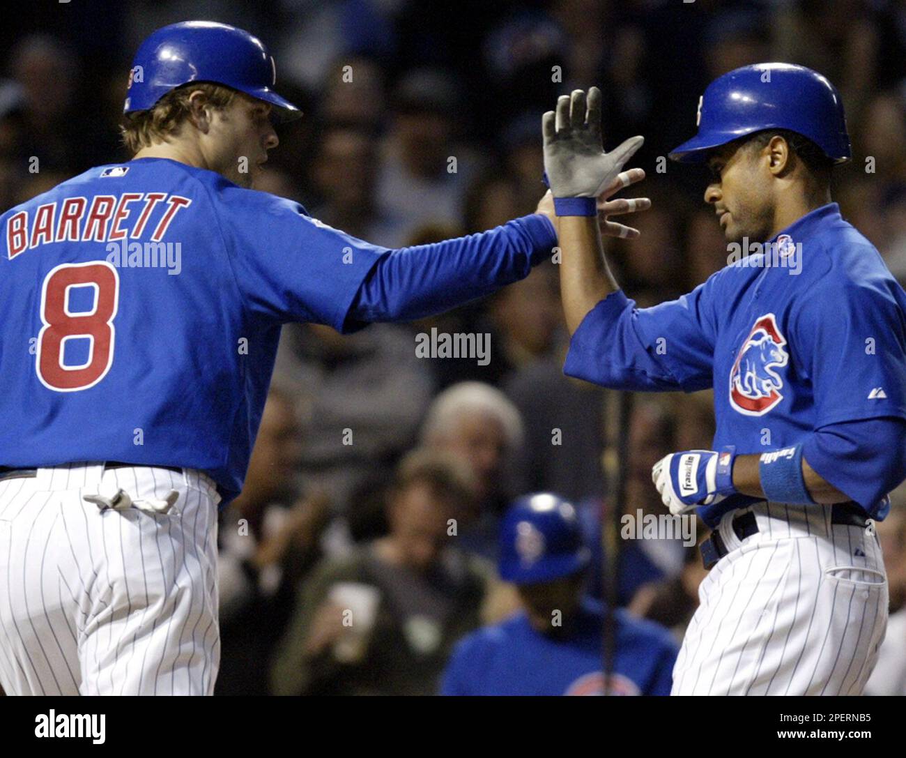 Chicago Cubs' Corey Patterson, right, celebrates with Michael