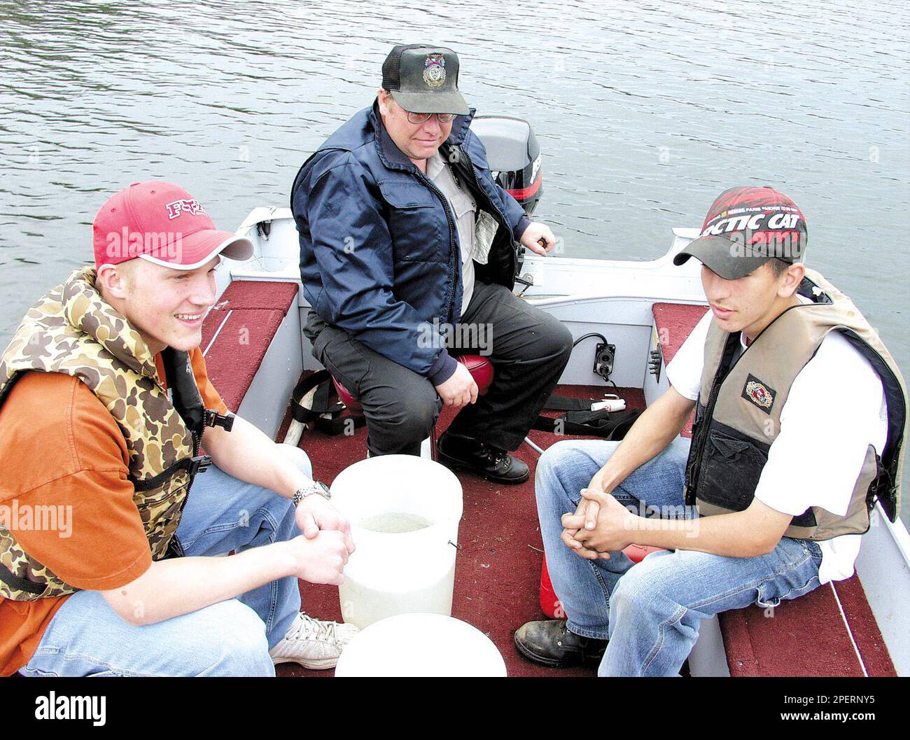 Conservation warden Dean Gullickson drives a boat to the middle of