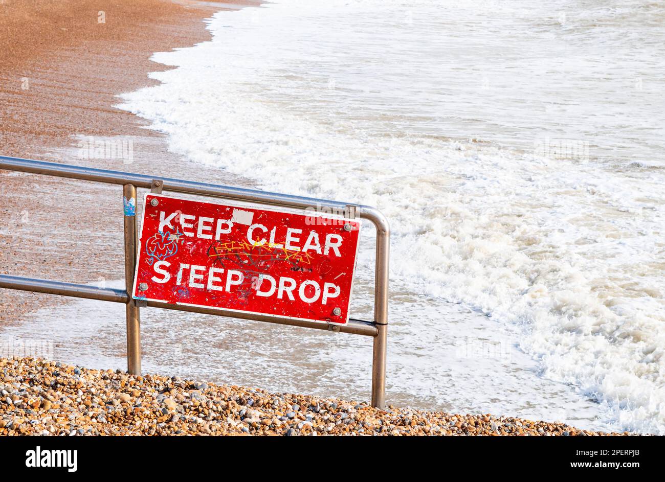 red sigh keep clear steep drop near the sea,dangerous for life Stock Photo