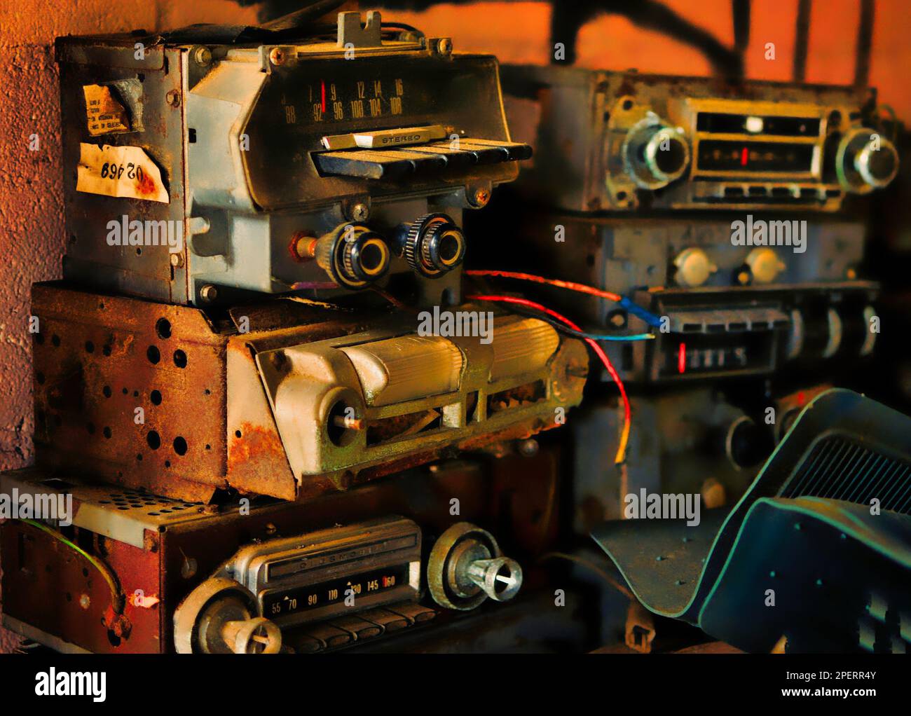 An array of vintage radios are situated inside a workshop as part of a repair process Stock Photo