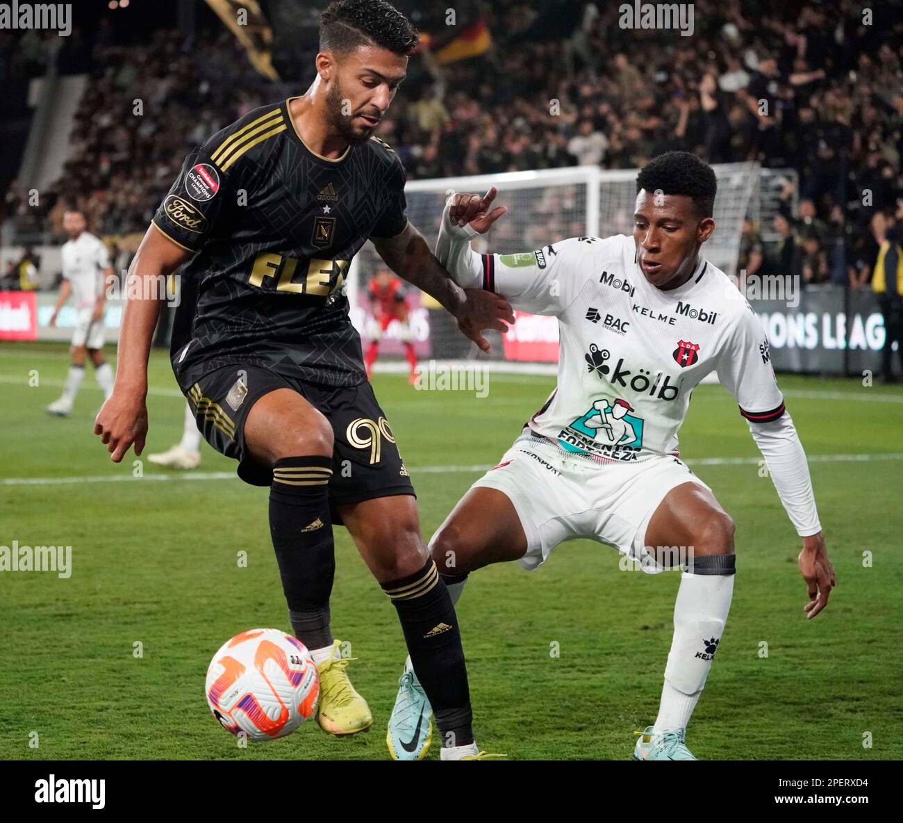 March 15, 2023: LAFC forward Denis Bouanga holds off the challenge