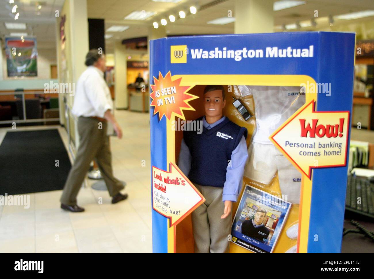 A Washington Mutual bank teller doll is seen on the concierge desk at the  downtown Seattle Washington Mutual branch, Wednesday Aug. 4, 2004.  Washington Mutual began using the dolls in an advertising