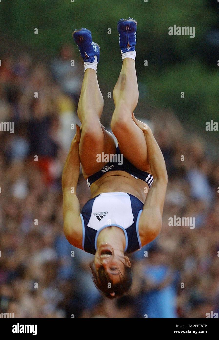 Russia's Yelena Isinbayeva somersaults in celebration after she jumped