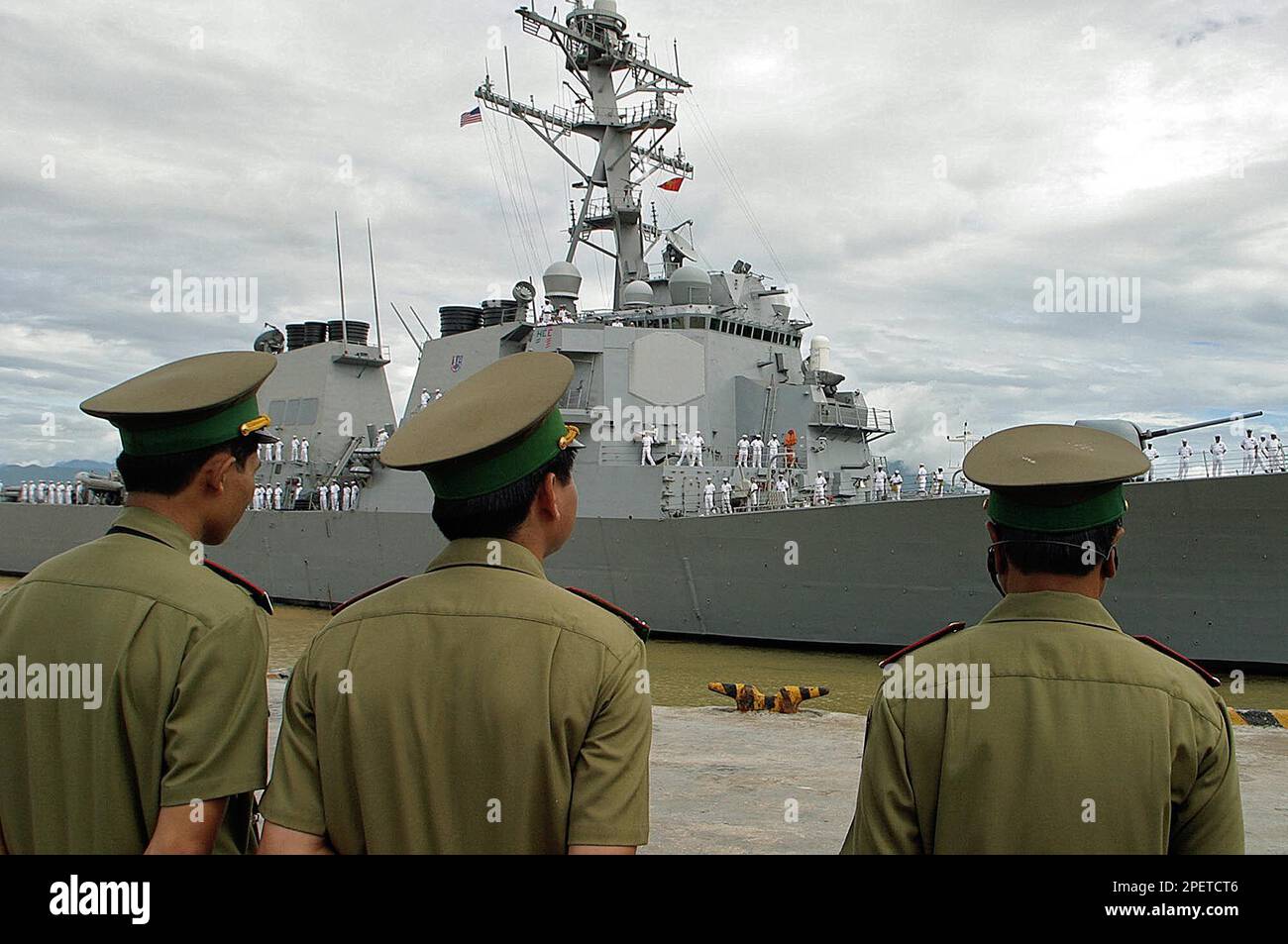 Vietnamese coast guard watch as the USS Curtis Wilbur, a guided missile ...