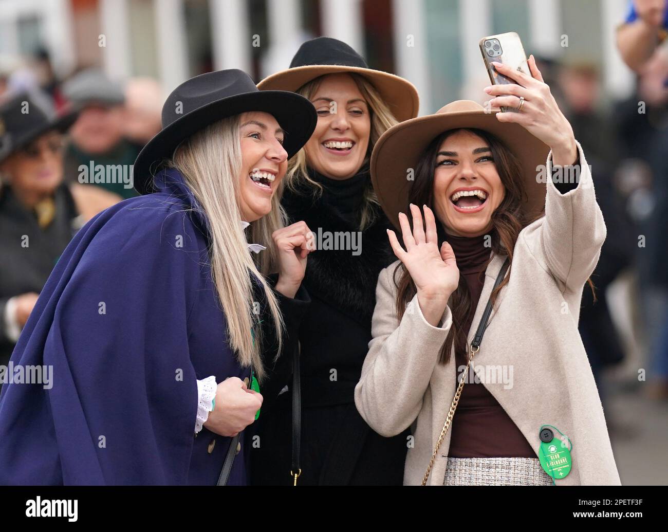 Racegoers pose for a photgraph ahead of day three of the Cheltenham Festival at Cheltenham Racecourse. Picture date: Thursday March 16, 2023. Stock Photo