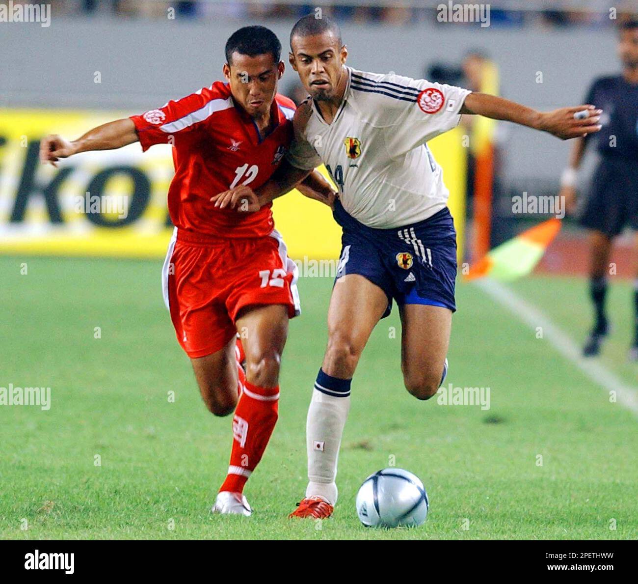 Japan's Alessandro Santos, right, and Thailand's Surasing Nirut