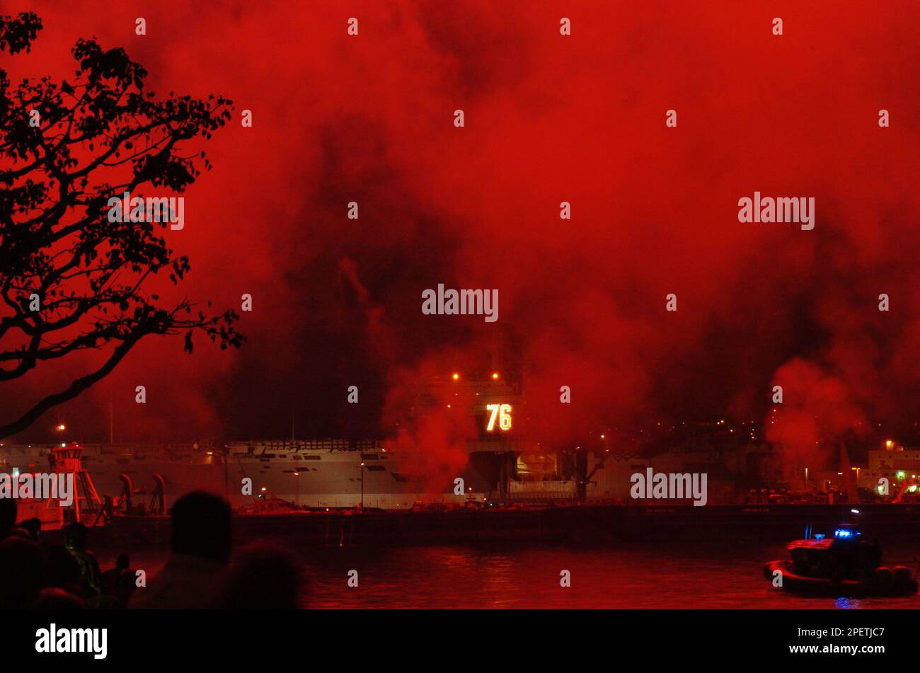 A fireworks display goes off in front of the USS Reagan in San Diego