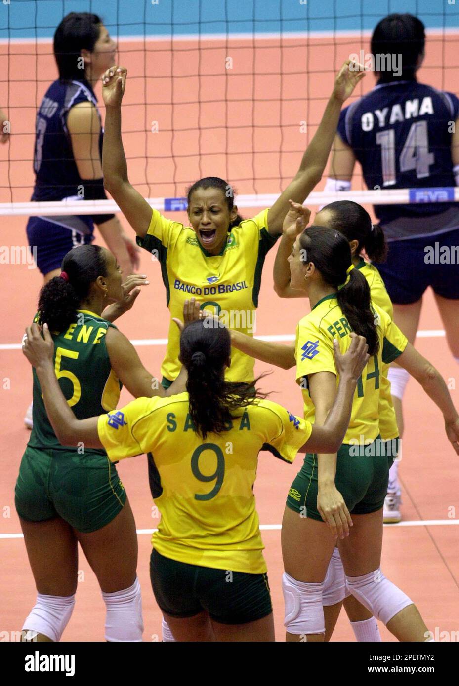 Brazil's Menezes Valeska, center, celebrates with her teammates after  scoring against Japan during the Women's World volleyball Grand Prix on  Jeju island, South Korea, Thursday, July 22. 2004. Brazil defeated Japan  25-13