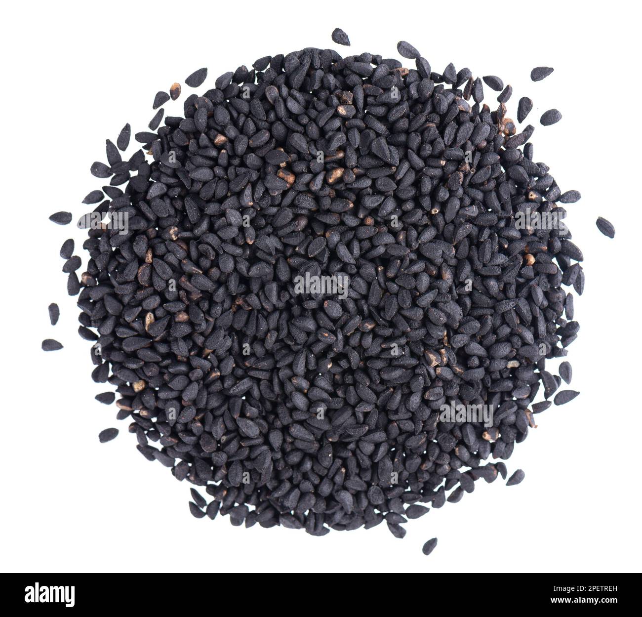 Black cumin seeds isolated on white background. Heap of black nigella