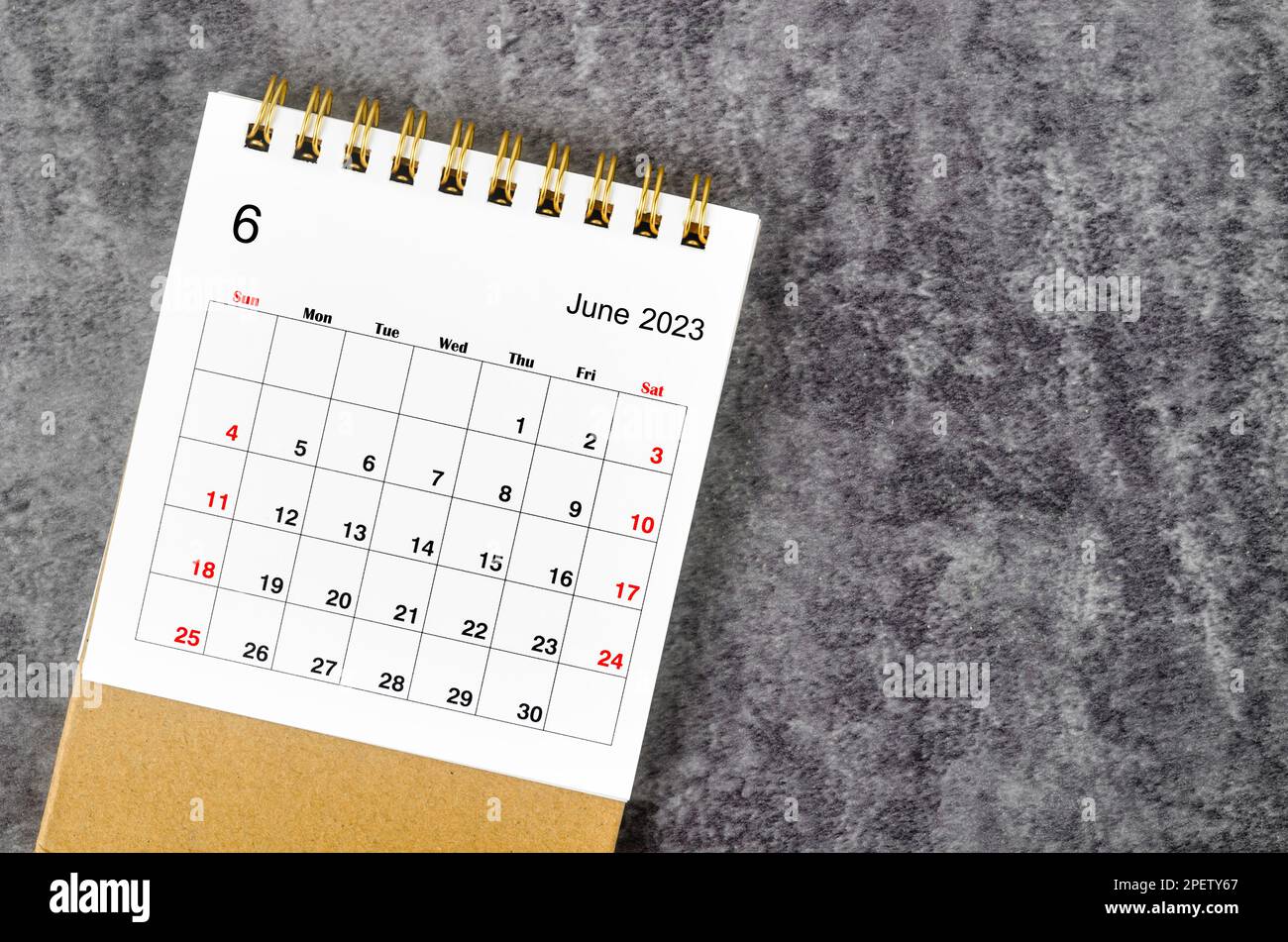 June 2023 Monthly desk calendar for 2023 year on wooden table Stock