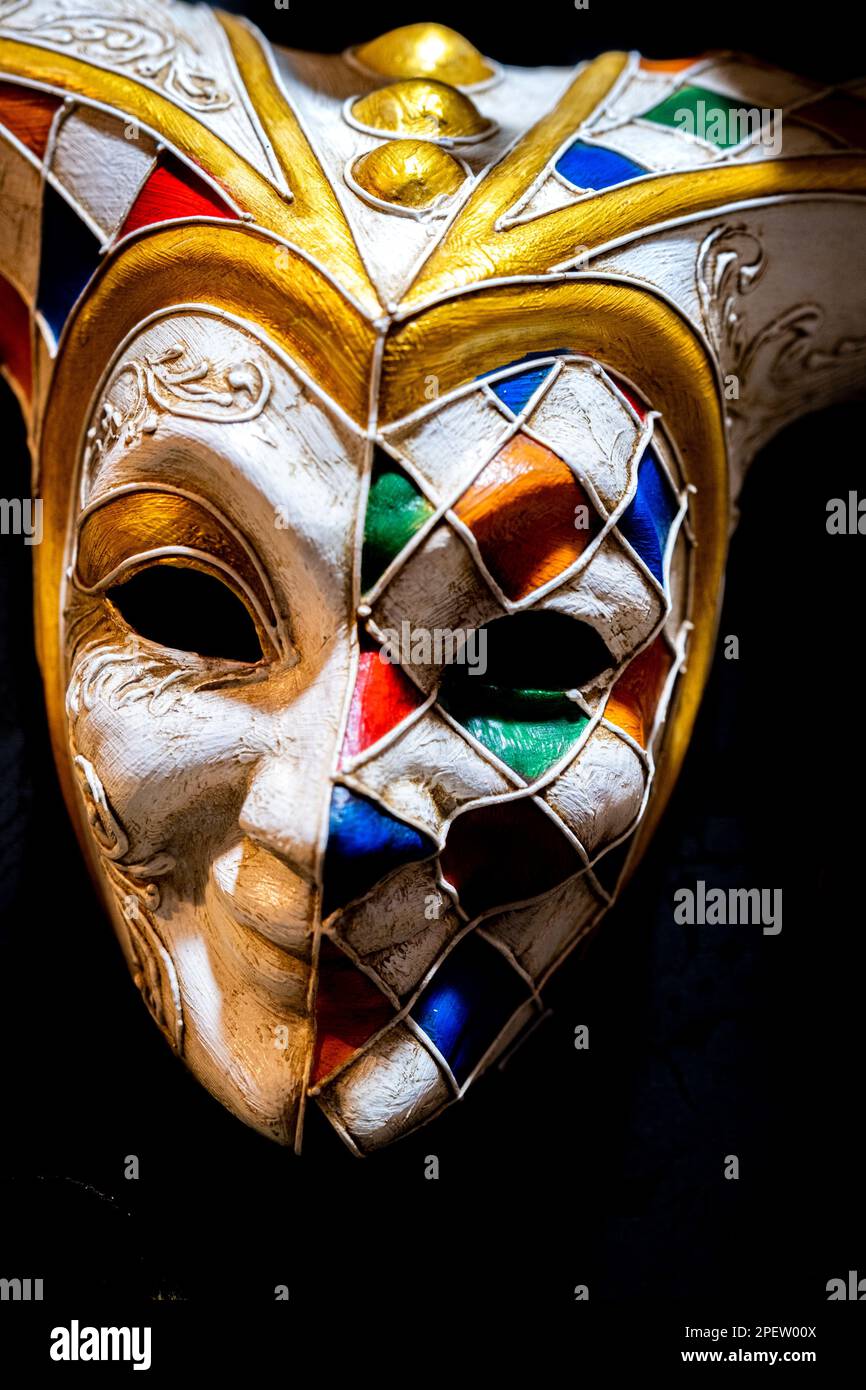 A colorful masquerade mask isolated on a black background Stock Photo ...
