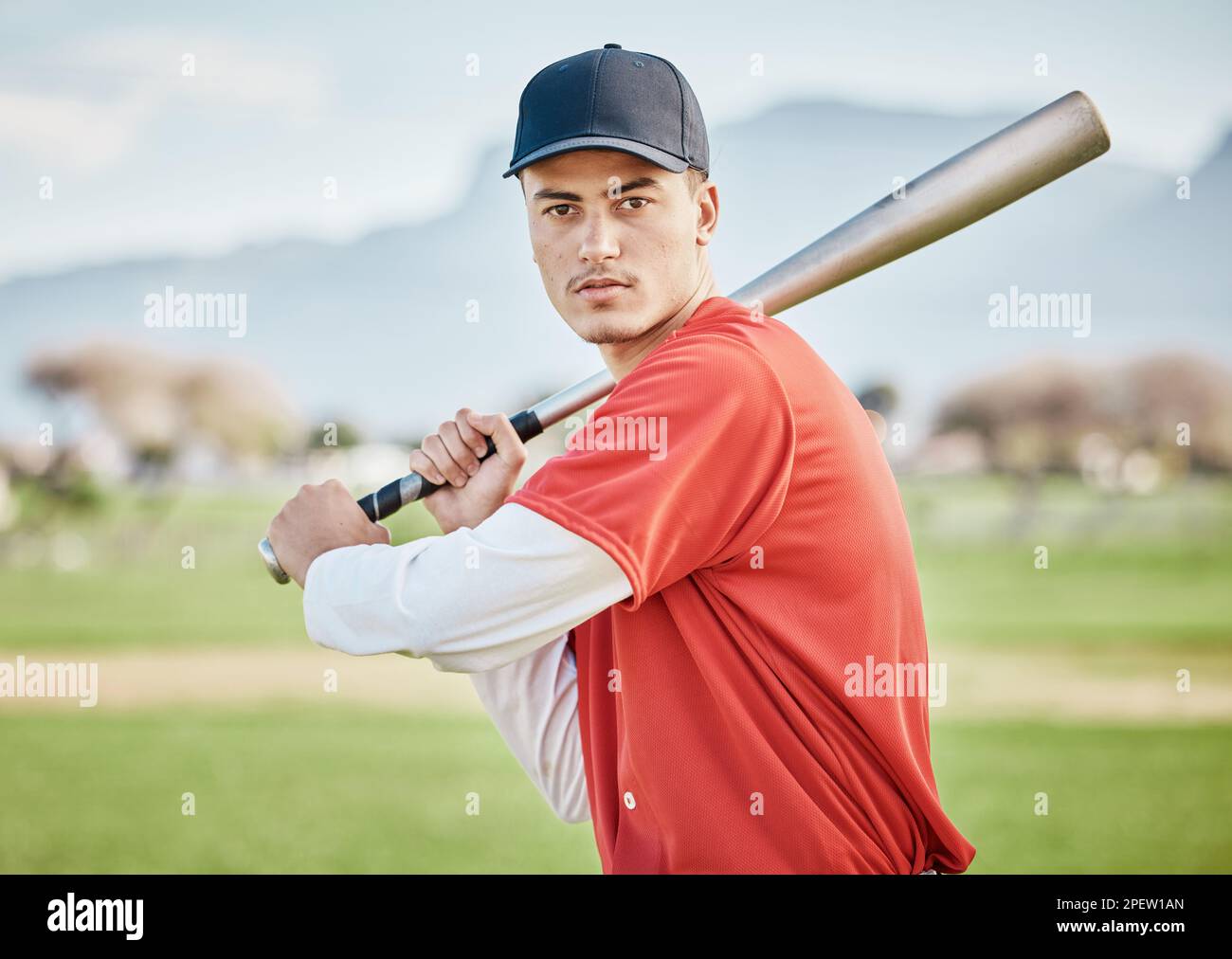 Baseball batter, portrait or sports man on field at competition, training match on a stadium pitch. Softball exercise, healthy fitness workout or Stock Photo