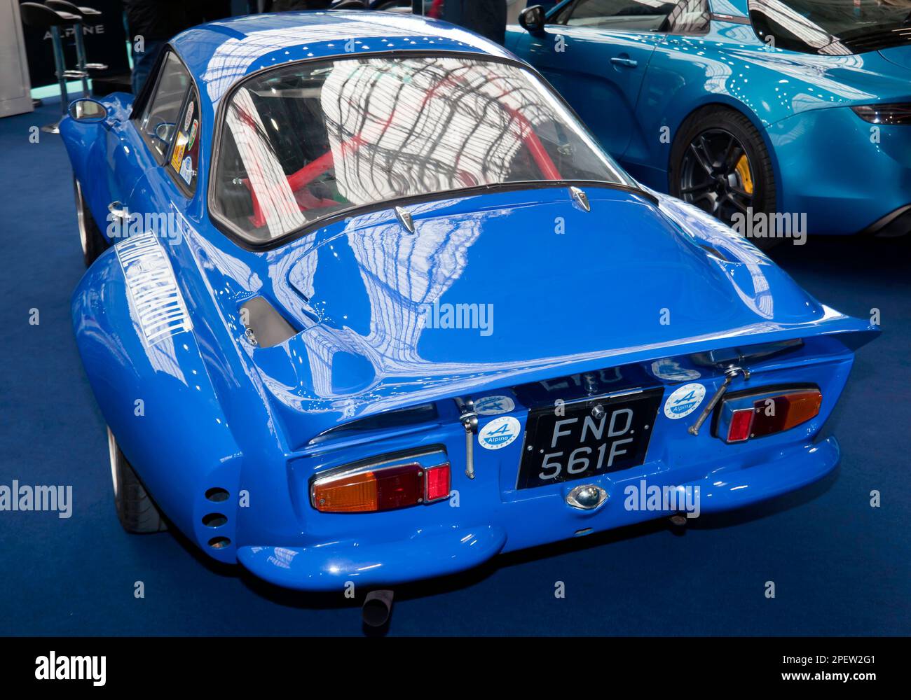 Three-quarters rear view of a Blue, 1967, Renault Alpine A110, on display at the 2023 London Classic Car Show Stock Photo
