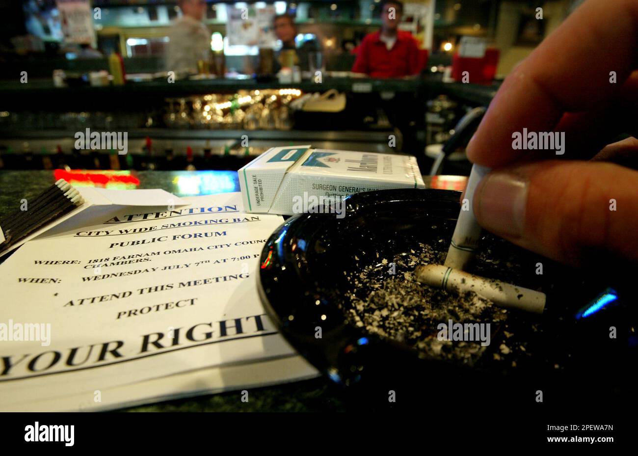 Another cigarette is snuffed out at Clancy's Pub in Omaha, Neb. Monday July  5, 2004. Omaha city counselman Mark Kraft is looking into the idea of  proposing a smoking ban in bars