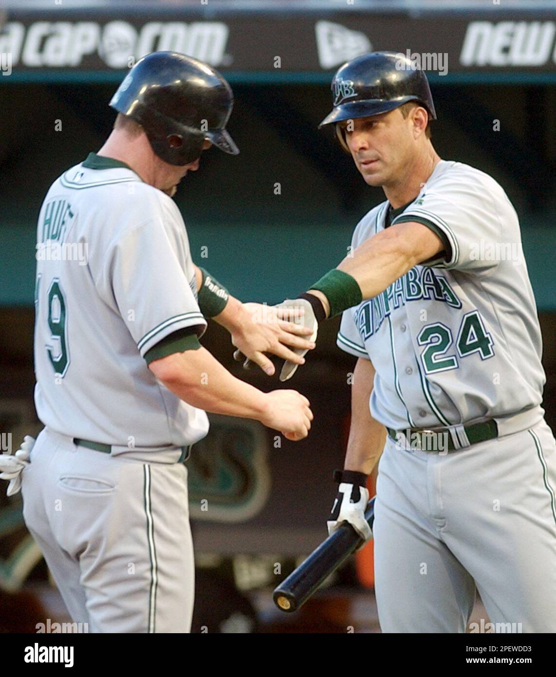 Tampa Bay Devil Rays' Aubrey Huff, left is congratulated by