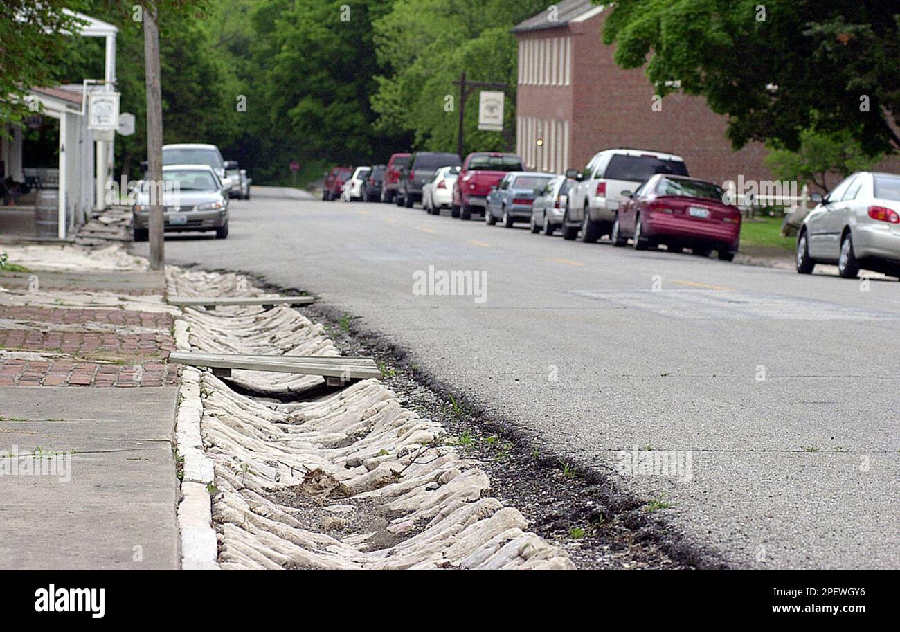 The worn limestone gutters in Arrow Rock, Mo., shown May 19, 2004, were ...