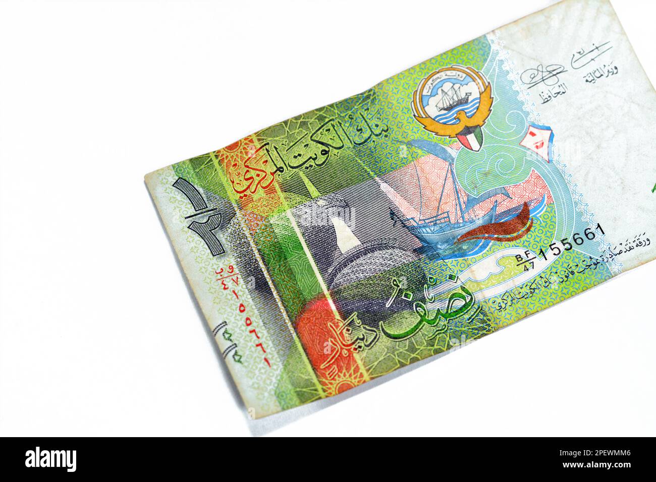 obverse side of Kuwaiti half dinar green paper banknote cash money bill currency features Kuwait Towers and a dhow ship issue 2014 with coat of arms a Stock Photo