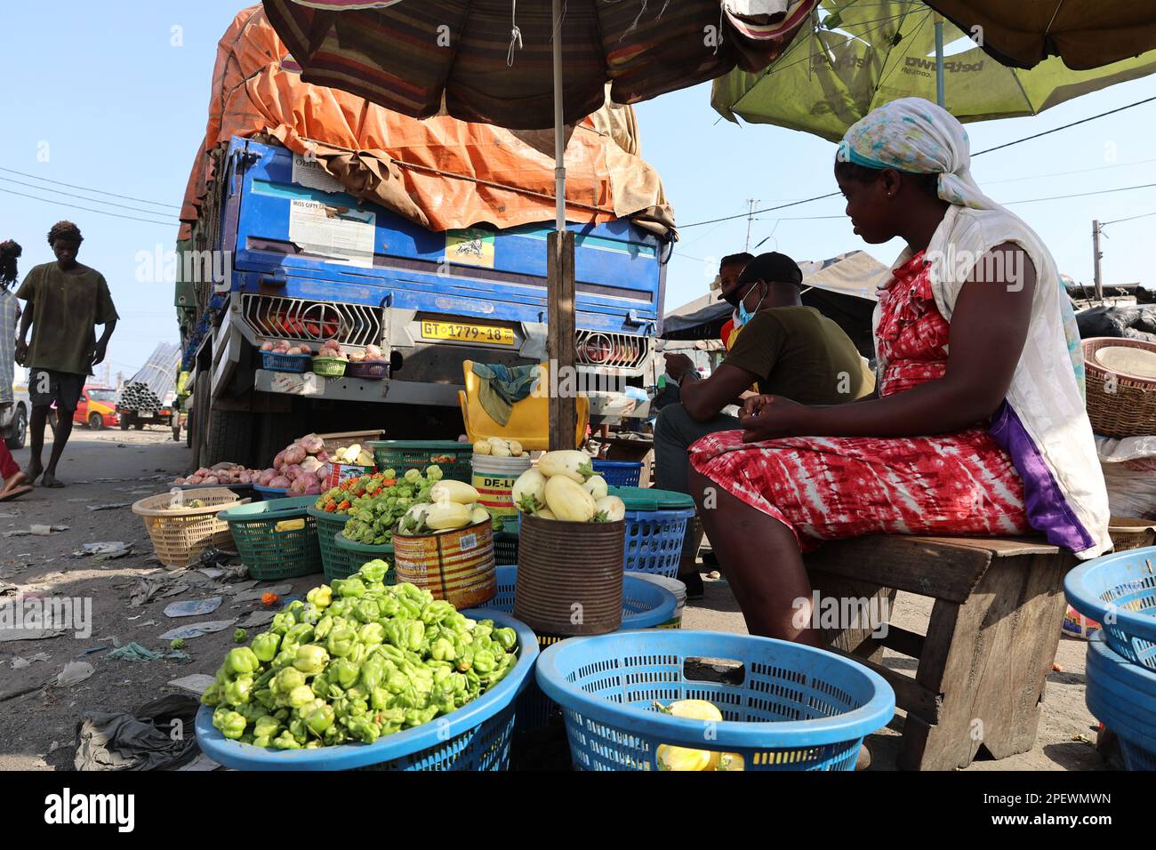 Accra, Ghana. 15th Mar, 2023. Vendors sell vegetables in a street in