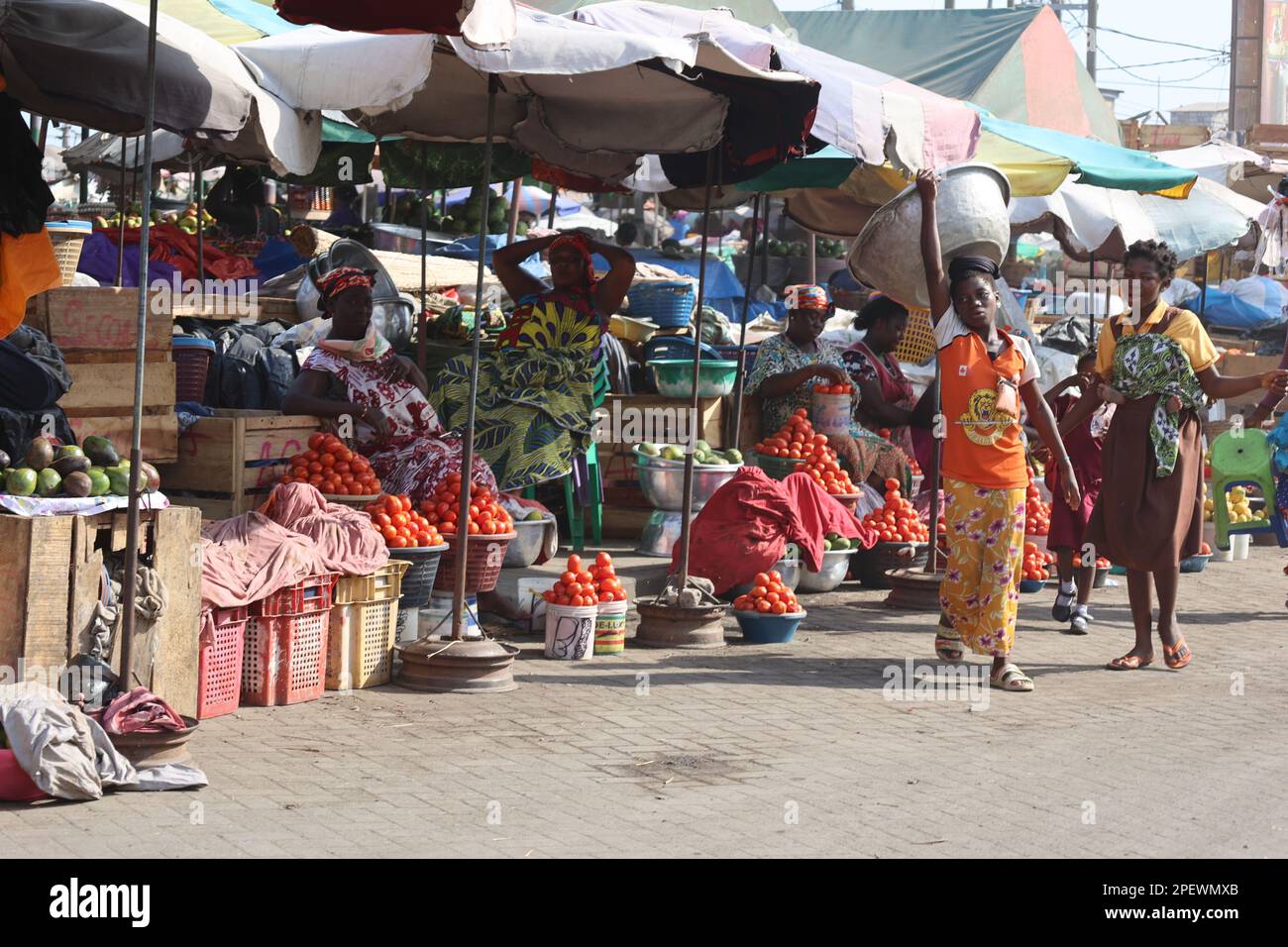 Accra, Ghana. 15th Mar, 2023. Vendors sell goods at a market in Accra