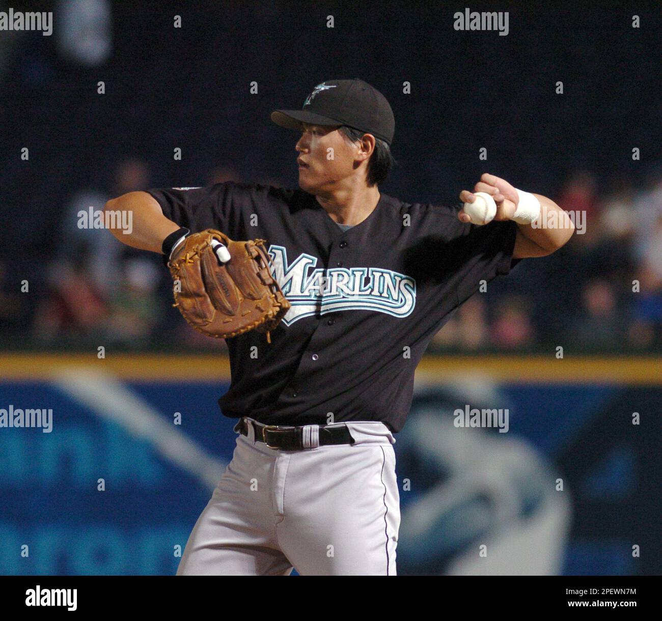 Florida Marlins first baseman Hee Seop Choi, of South Korea, warms up  during the first inning, Monday, June 28, 2004, at Turner Field in Atlanta.  (AP Photo/Gregory Smith Stock Photo - Alamy