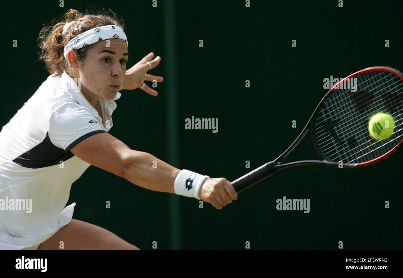Spain's Virginia Ruano Pascual, plays a return to Italy's Silvia Farina Elia, during their Women's Singles, match at Wimbledon, Sunday June 27, 2004. For the third time in the tournament's 127-year history play is being held on the traditional middle Sunday rest day. (AP Photo/Sang Tan) ** EDITORIAL USE ONLY ** Stock Photo