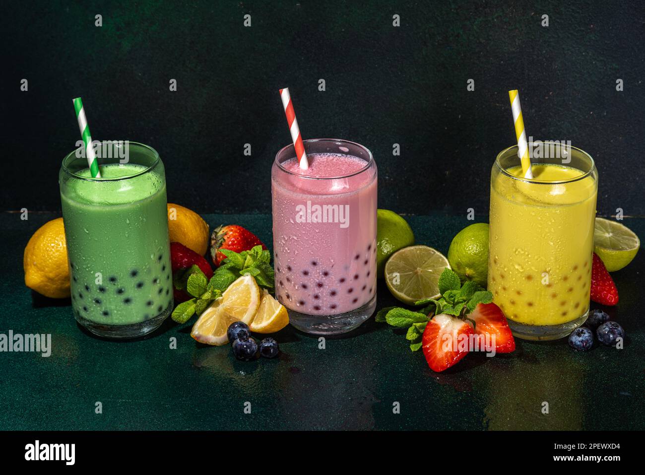 Set of three colorful summer bubble tea, bright creamy pearl tea or ...