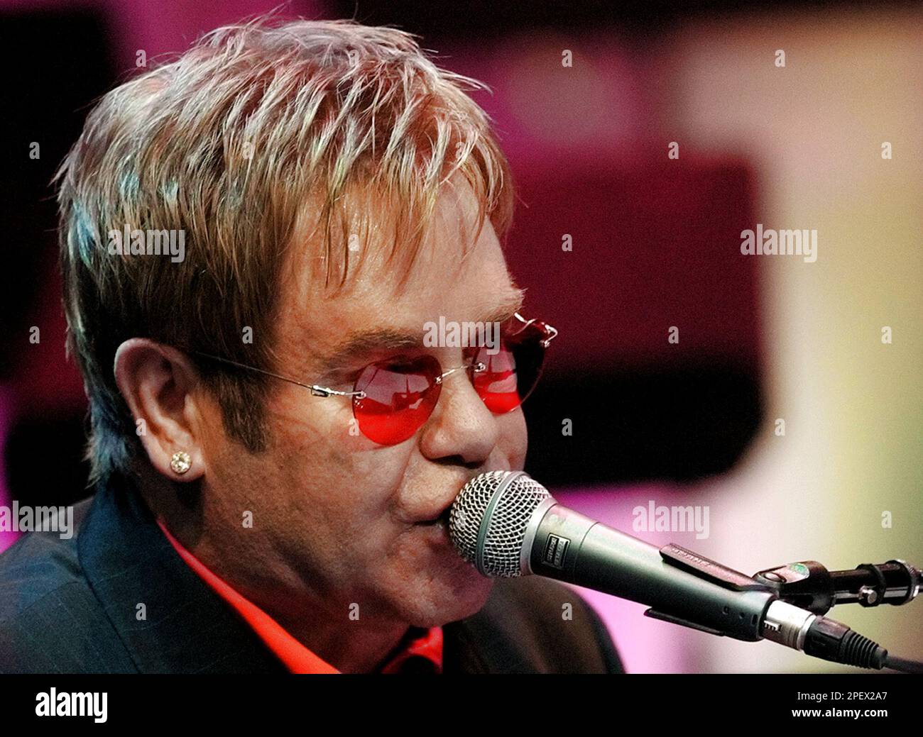 British pop star Sir Elton John performs some of the songs he wrote for the  musical, Billy Elliot The Musical, during a preview in London Tuesday June  22, 2004. The musical which
