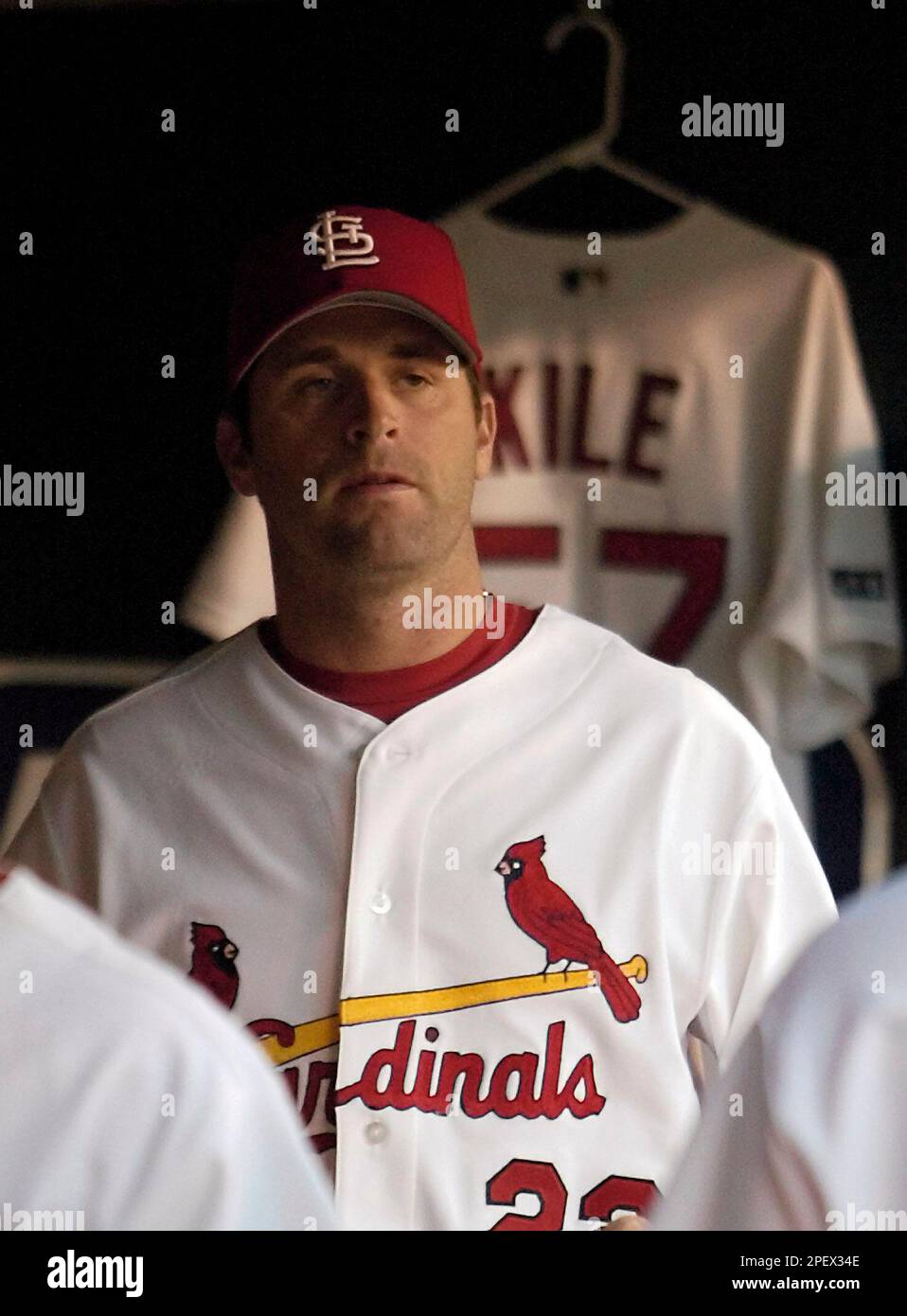 St. Louis Cardinals' Mike Matheny watches the game against the Chicago Cubs  near Darryl Kile's jersey, on the second anniversary of Kile's death,  Tuesday, June 22, 2004, in St. Louis. (AP Photo/Tom