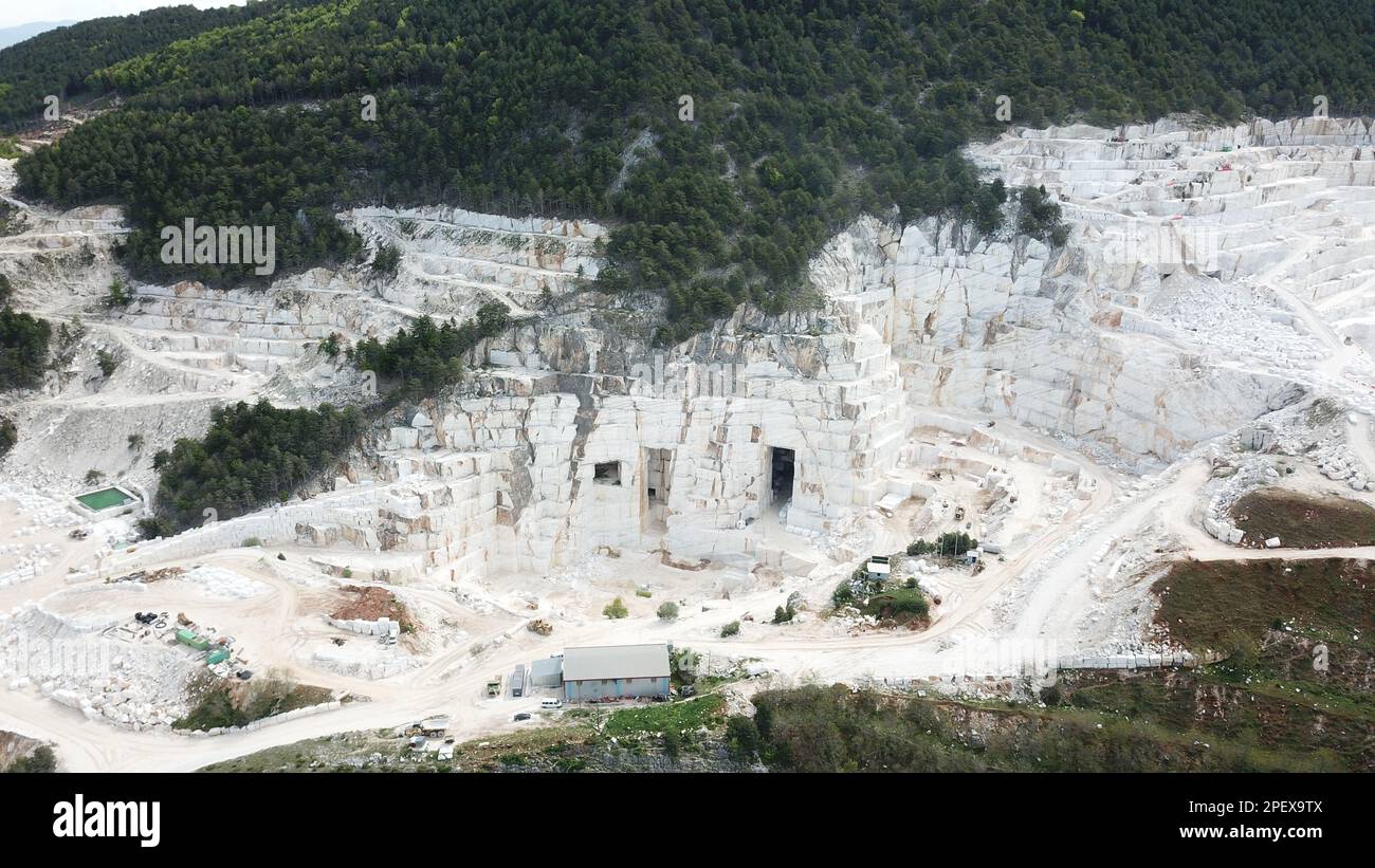 Heavy machines working at a huge marble quarry in Europe. Transporting