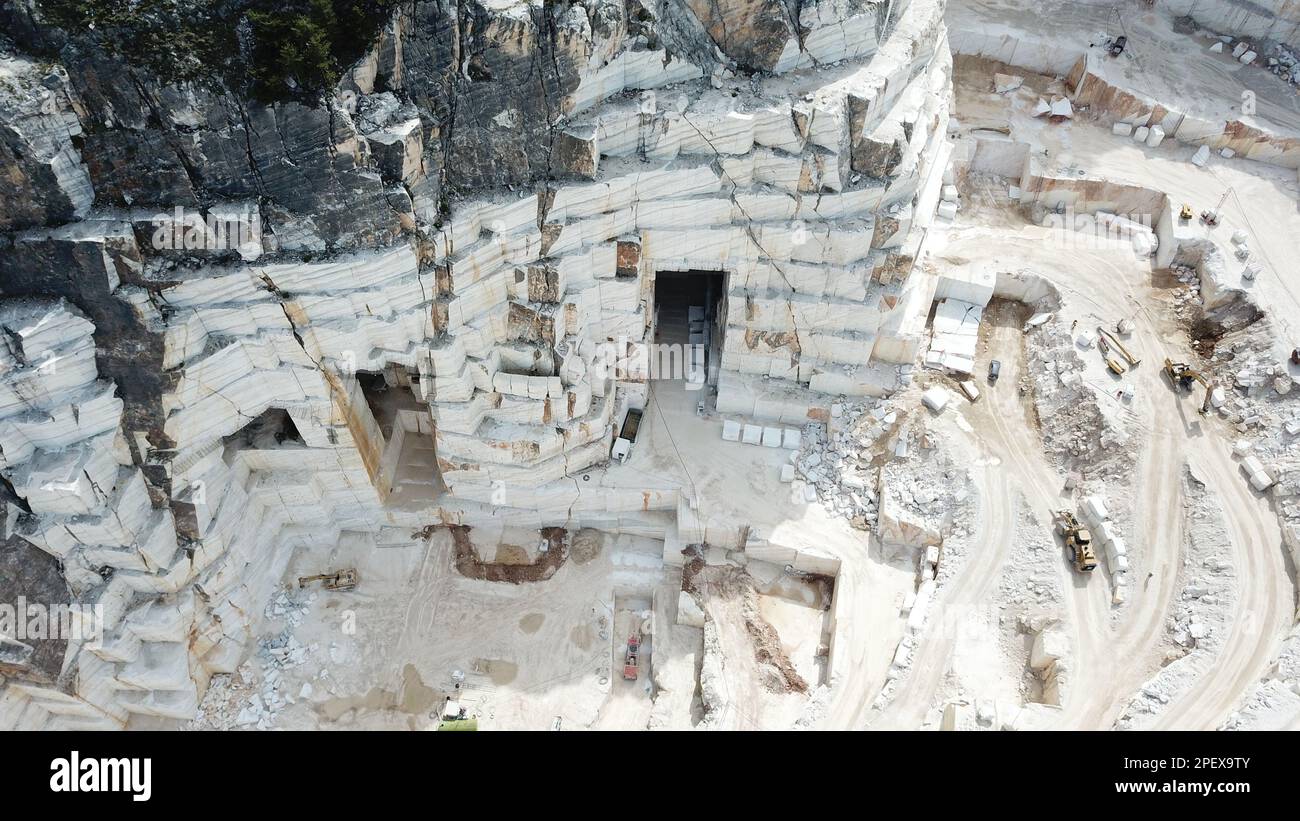 Heavy machines working at a huge marble quarry in Europe. Transporting