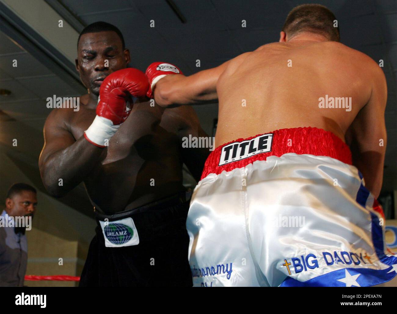 Heavyweight Rob Calloway, right, throws a punch at former heavyweight  champion Hasim Rahman in the first round Thursday, June 17, 2004, in Glen  Burnie, Md. Rahman won the fight in the second