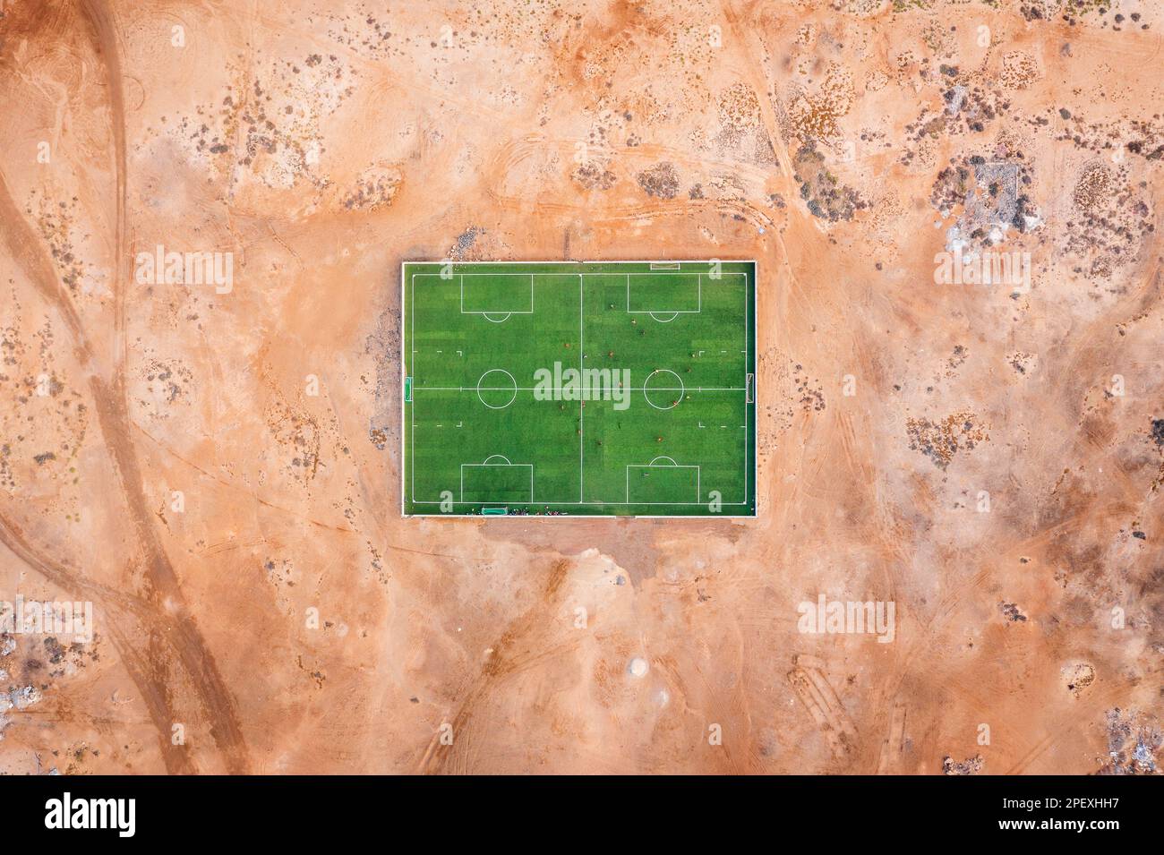 Playing soccer in desert dust beneath the Rifa-Fort, Rifa, Kingdom