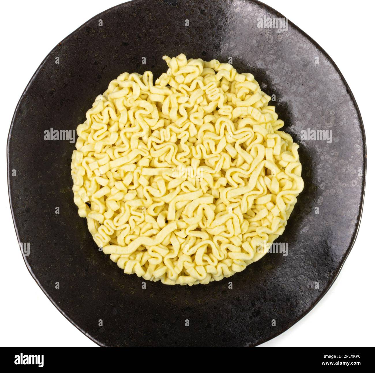 Dry Instant Noodles Isolated, Round Asian Pasta on Black Plate