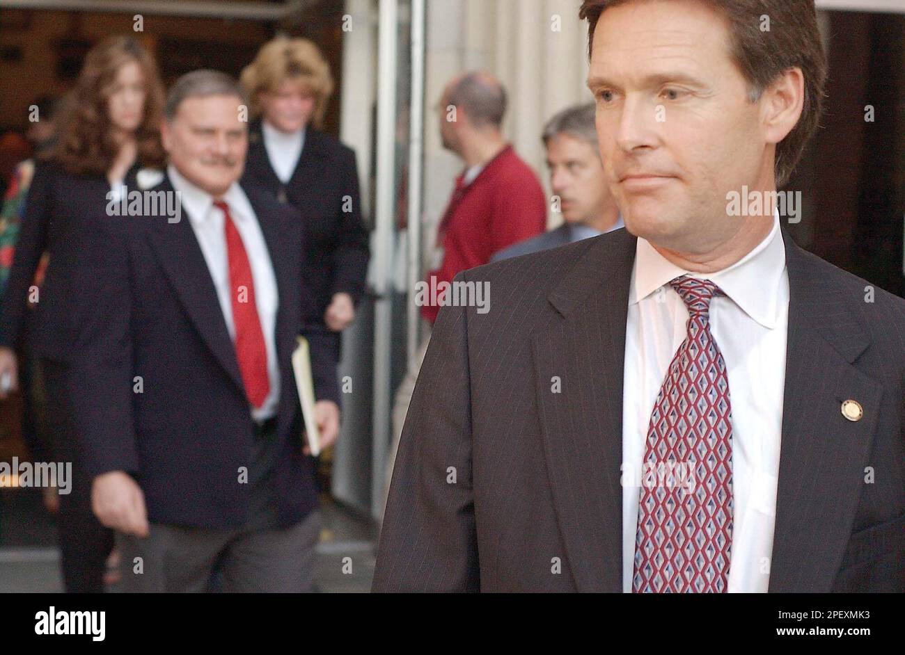 Oklahoma County District Attorney Wes Lane, right, leaves the Pittsburg