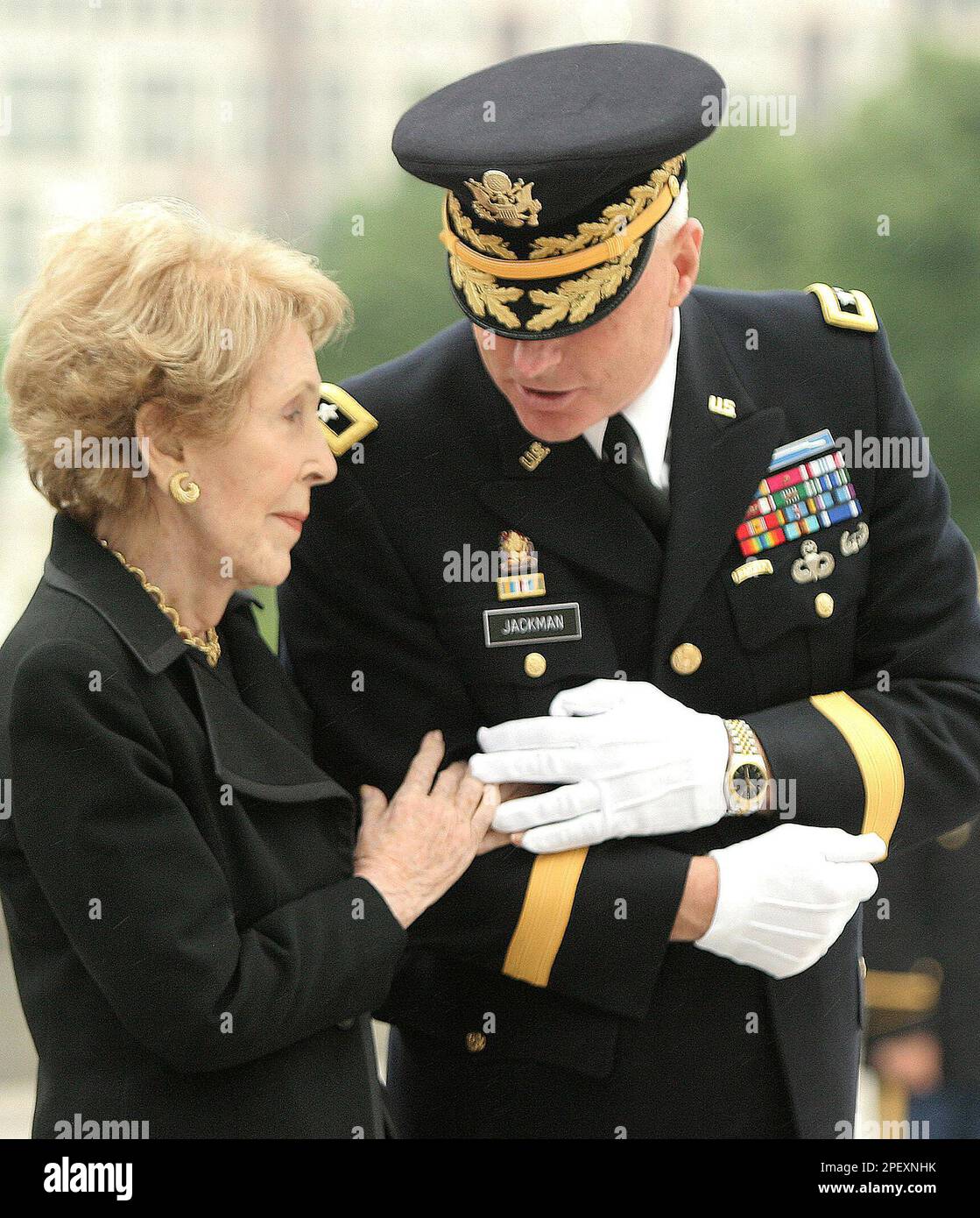 Former first lady Nancy Reagan listens to her military escort, Maj. Gen ...