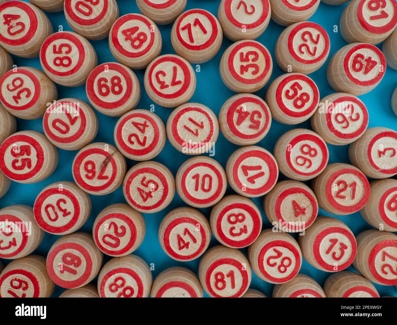 Board game bingo. Wooden barrels with lotto numbers, playing cards for