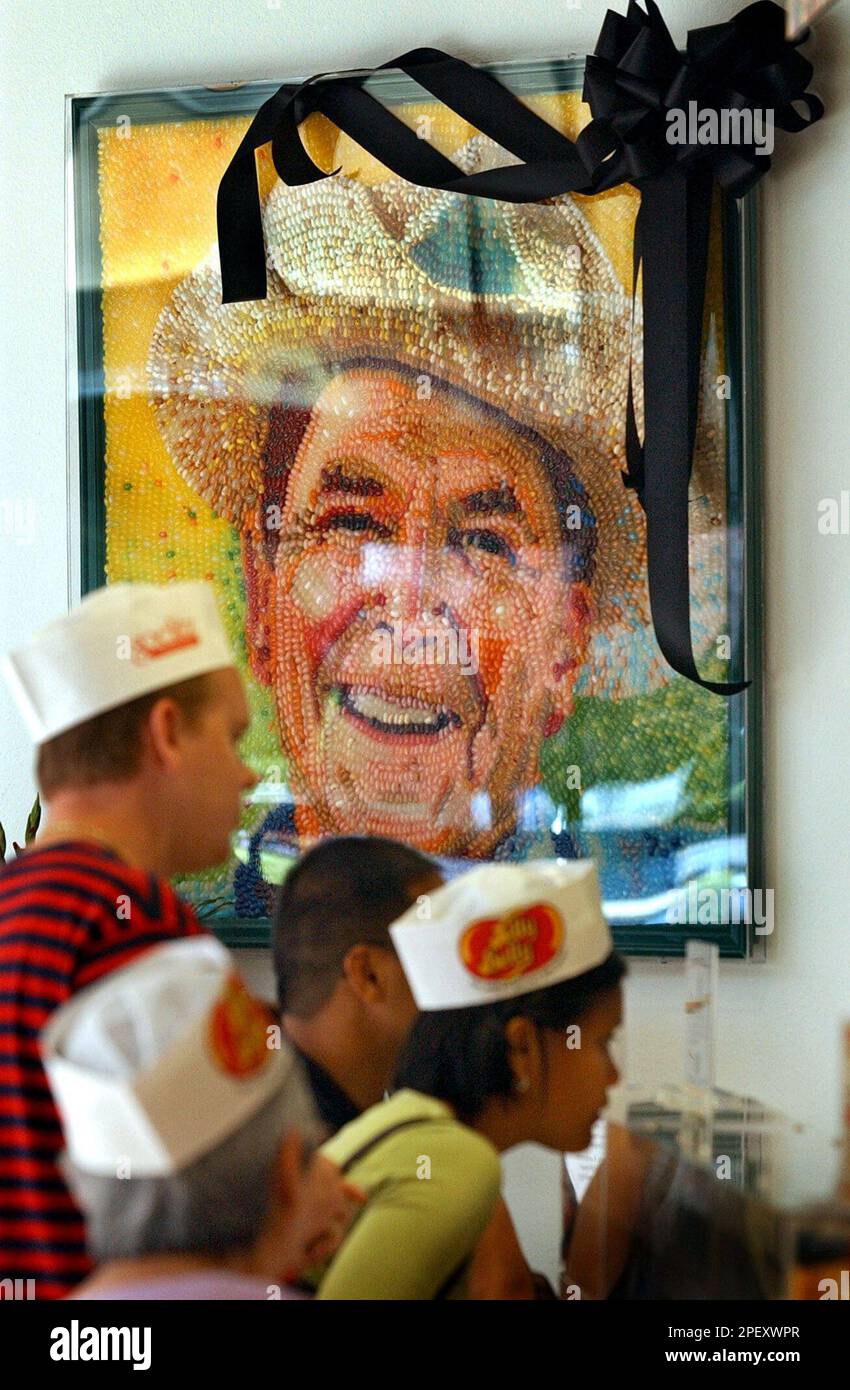 Visitors to the Jelly Belly jelly bean factory wait at a counter near a ...